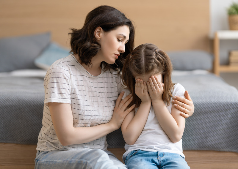 Mother consoling her child